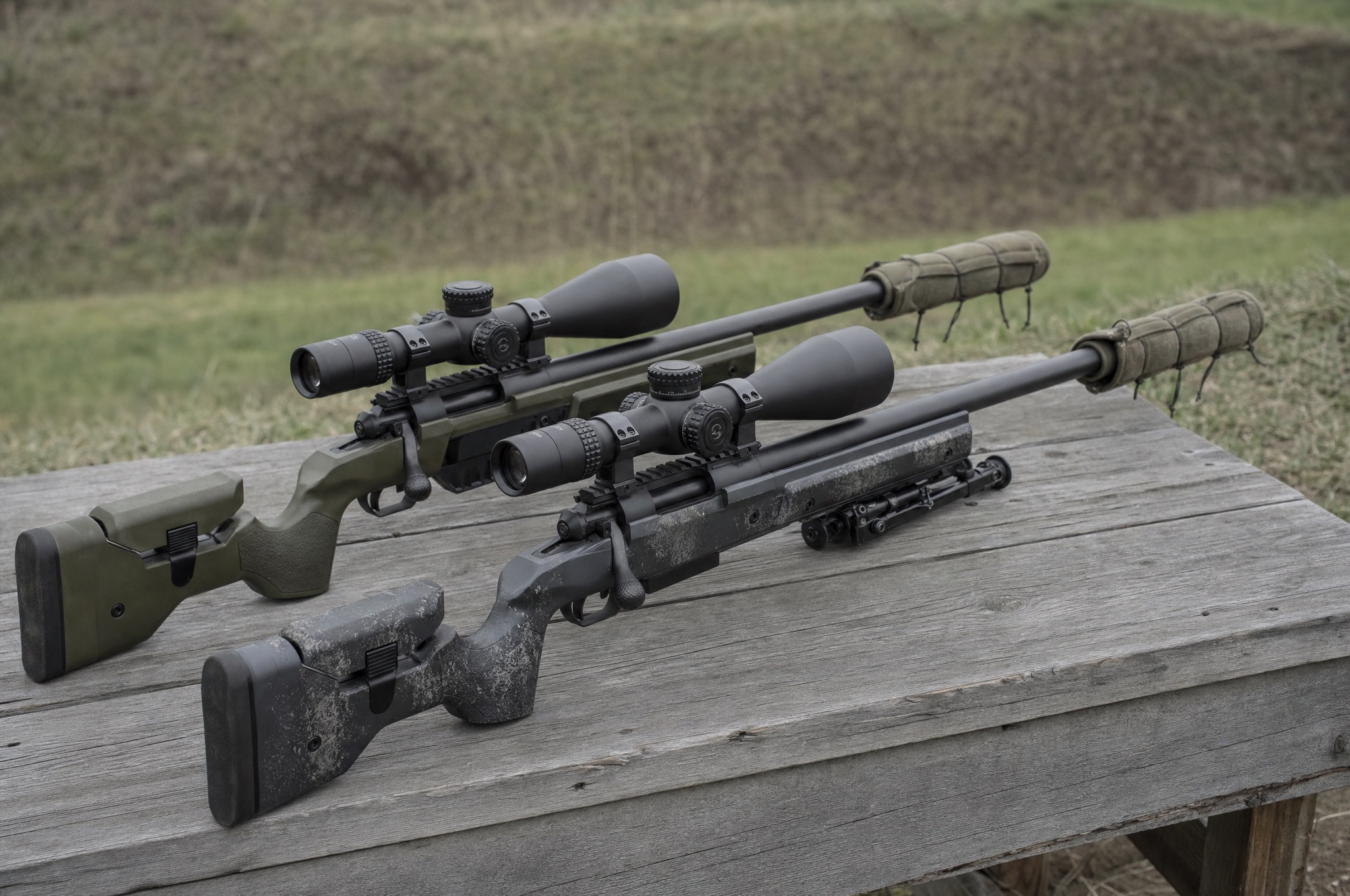 Modular suppressor with a muzzle brake threaded onto a competition rifle barrel